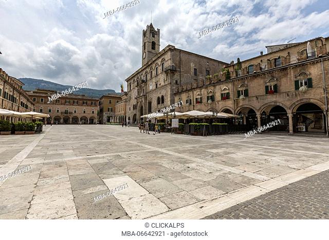 The old arcades frame the historical buildings of Piazza del Popolo Ascoli Piceno Marche Italy Europe