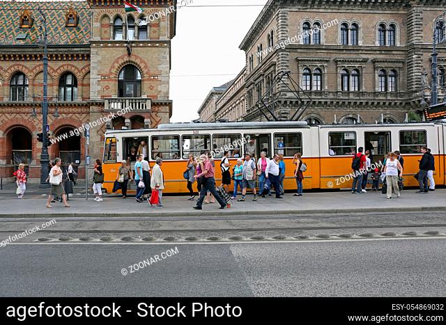 Budapest, Hungary - July 13, 2015: People at Tram Station in Front of Central Market Hall at Vamhaz Street in Budapest, Hungary