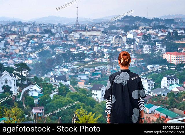 Beautiful woman overlooking the city view, Dalat, Vietnam
