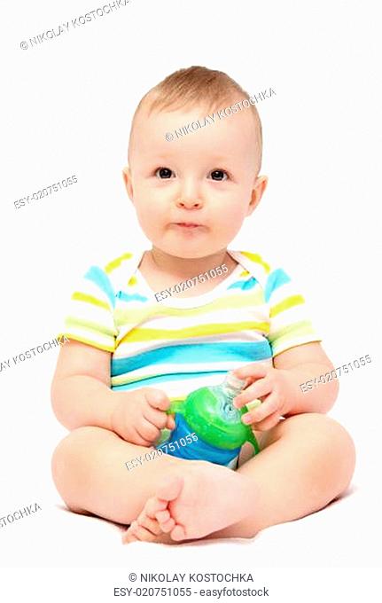 baby boy holding milk bottle