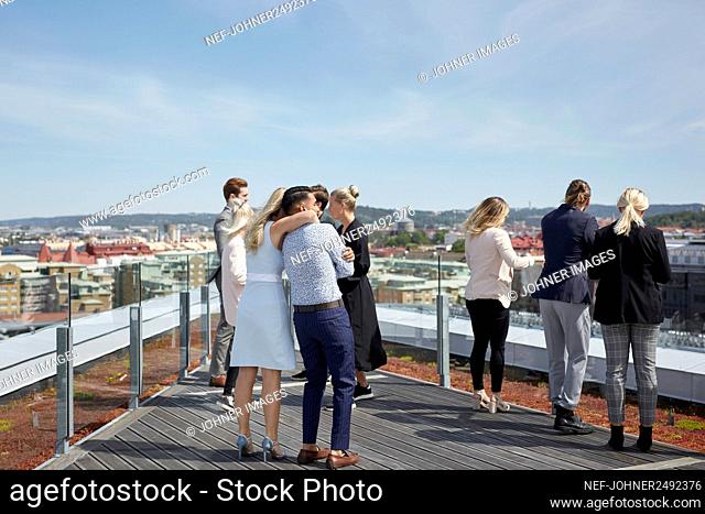 People looking at view from terrace