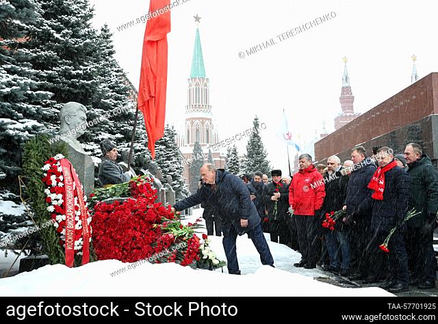 RUSSIA, MOSCOW - MARCH 5, 2023: Russian Communist Party leader Gennady Zyuganov (C) lays flowers at the grave of Soviet leader Joseph Stalin by the Kremlin Wall...