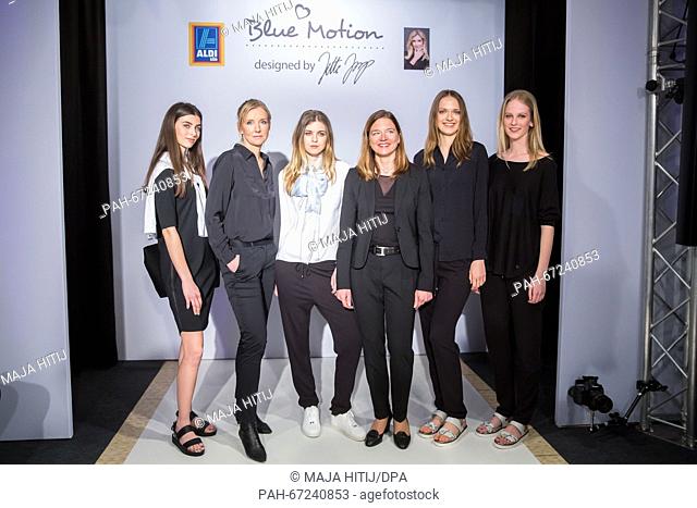 Fashion designer Jette Joop (2nd L) , Kim Aline Suckow (3rd R) , the deputy CEO of purchase at retail discounter Aldi Sued and models stand on the catwalk...