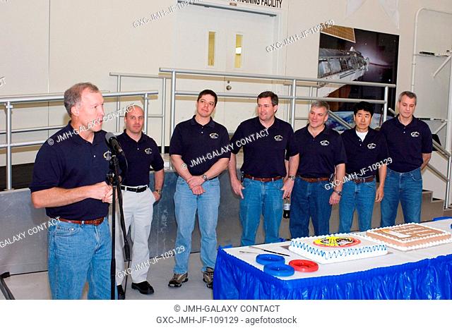 NASA astronaut Dominic L. Gorie, STS-123 commander, speaks to a crowd at a cake-cutting ceremony in the Jake Garn Simulation and Training Facility at Johnson...
