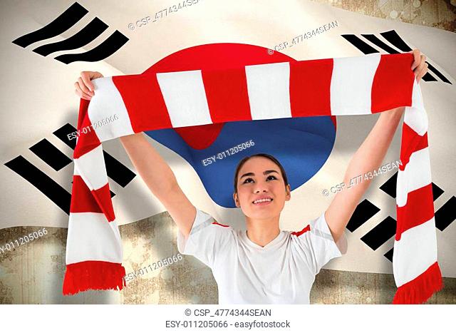 Composite image of football fan waving red and white scarf