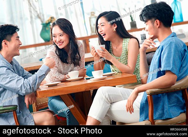 Young friends drink coffee chat