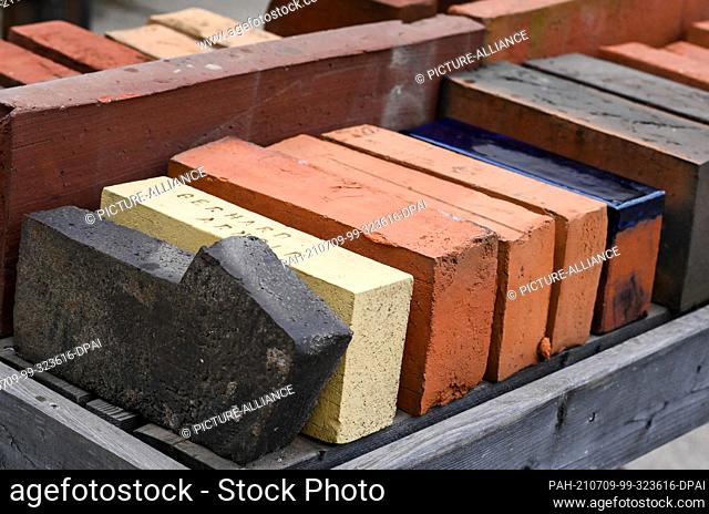 08 July 2021, Brandenburg, Werder (Havel): Various handmade bricks are on display at the Neue Ziegel-Manufaktur Glindow. The traditional company specialises in...
