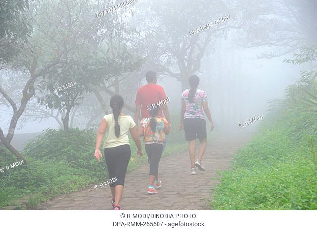 Family walking to Sinhagad fort, Pune, Maharashtra, India, Asia, MR#364