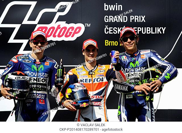 First placed Dani Pedrosa, of Spain, center, second placed Jorge Lorenzo, of Spain, left, and third placed Valentino Rossi, of Italy, right