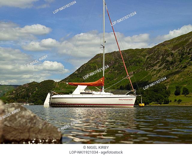 England, Cumbria, Ullswater. A yacht moored on Ullswater, England's most beautiful lake in the Lake District National park
