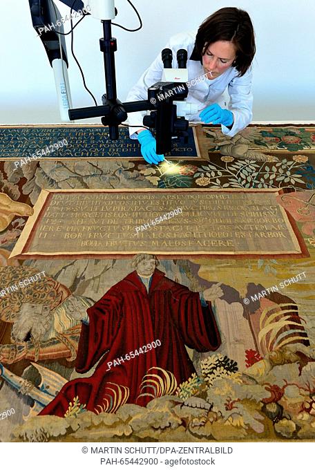 Laura Petzold, textile conservator of the Classics Foundation Weimar, works with concentration on a Reformation carpet of the Flemish active master Seger...