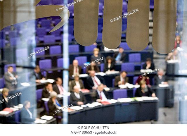 GERMANY, BERLIN, : German Bundestag: Session in the plenary hall of the Reichstag building. Parts of the federal eagle in the foreground