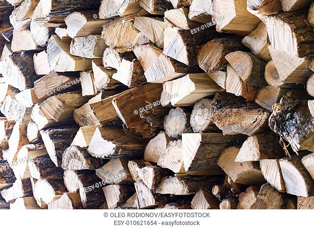 Woodpile from dry oak logs. Selective focus. For use as nature background
