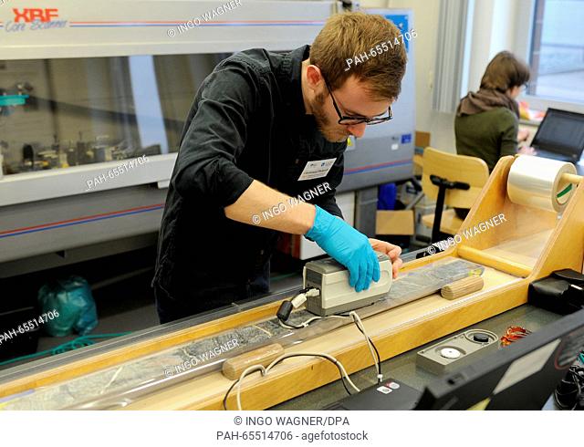 Marine scientist Laurence Philpott prepares the scan of a drill core sample from the bottom of the Atlantic Ocean in a laboratory of the MARUM of the University...