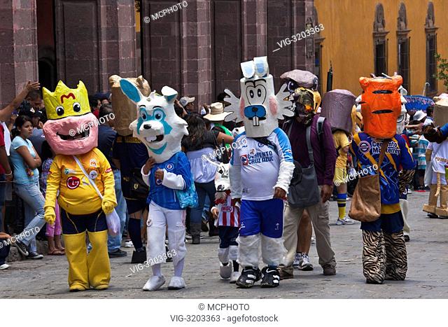 Mexicans dress in costumes and participate the DIA DE LOS LOCOS (DAY OF THE CRAZIES) PARADE - SAN MIGUEL DE ALLENDE, GUANAJUATO, MEXICO - 01/01/2012