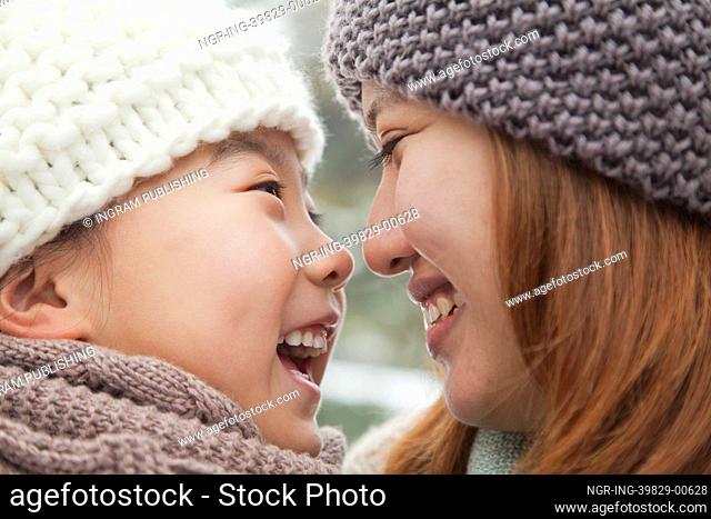 Mother and daughter nose to nose portrait