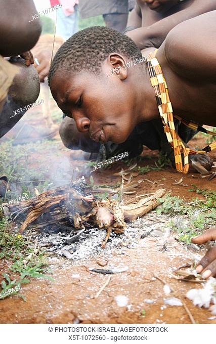 Africa, Tanzania, Lake Eyasi, Hadza men lighting a camp fire for cooking during a hunting expedition  Small tribe of hunter gatherers AKA Hadzabe Tribe April...