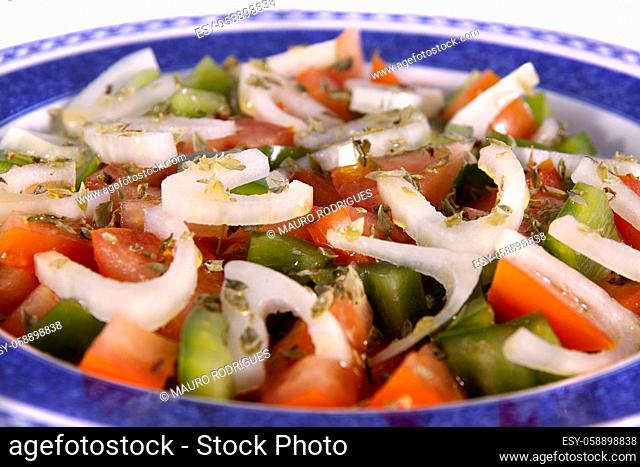 Detail view of a fresh made Mediterranean salad isolated on a white background