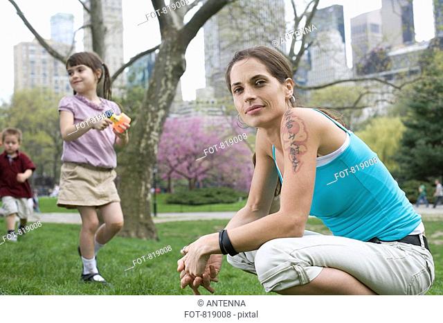 A woman and her children in Central Park, New York City