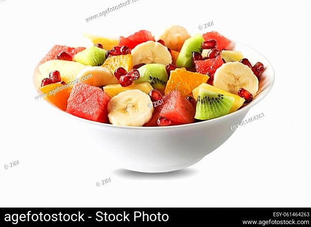 Bowl of healthy fresh mixed fruit salad isolated on white background