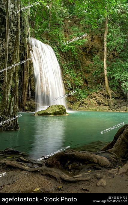 Clean green emerald water from the waterfall Surrounded by small trees - large trees, green colour, Erawan waterfall, Kanchanaburi province, Thailand