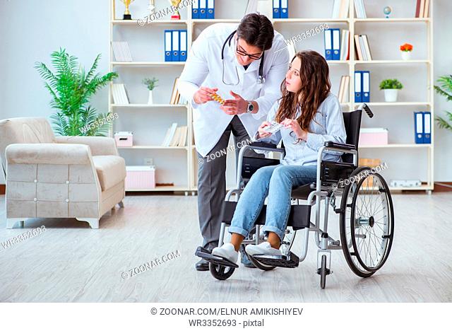 Disabled patient on wheelchair visiting doctor for regular check up
