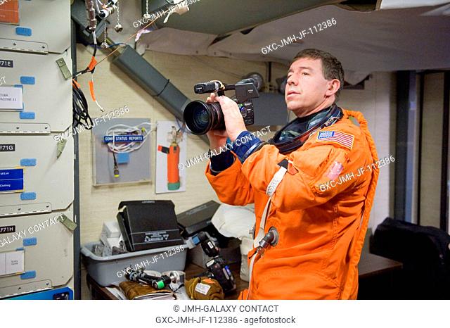 NASA astronaut Michael Barratt, STS-133 mission specialist, attired in a training version of his shuttle launch and entry suit