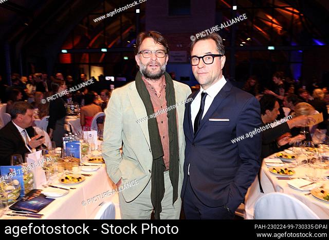 24 February 2023, Berlin: Thomas Kretschmann (l), actor, and Jan Josef Liefers, actor, are guests on the sidelines of the Berlinale at the Cinema for Peace Gala...