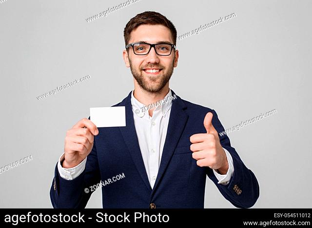 Business Concept - Portrait Handsome Business man showing name card with smiling confident face and thump up. White Background.Copy Space