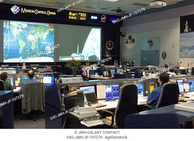 Overall view of the Shuttle Flight Control Room in the Johnson Space Center's Mission Control Center during the final deployment of some small satellites from...