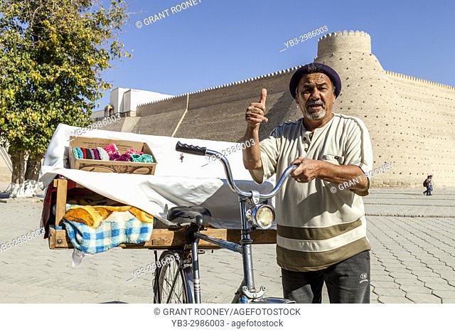 A Local Man Outside The Ark Fortress Selling Samsa (Meat Pies) From A Bicycle, Bukhara, Uzbekistan