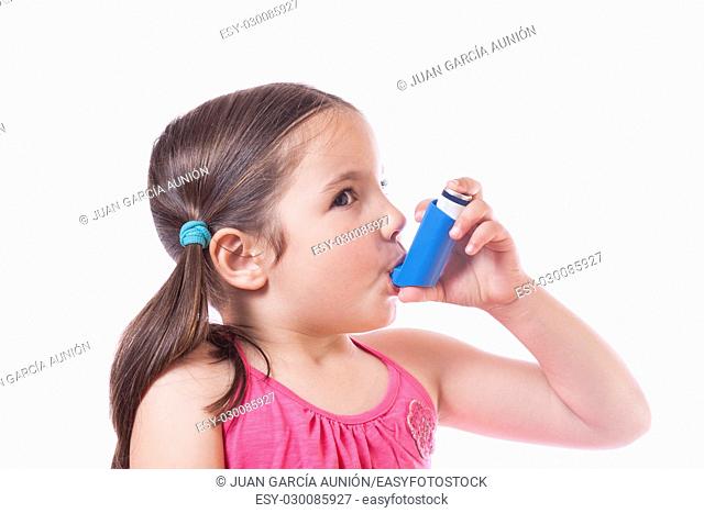 Little sick girl using medical spray for breath. Isolated over white background