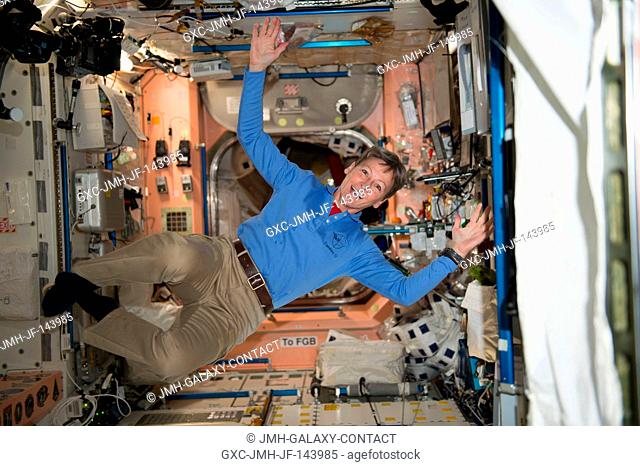 NASA astronaut Peggy Whitson floats through the Unity module aboard the International Space Station. On her third long-duration flight aboard the station