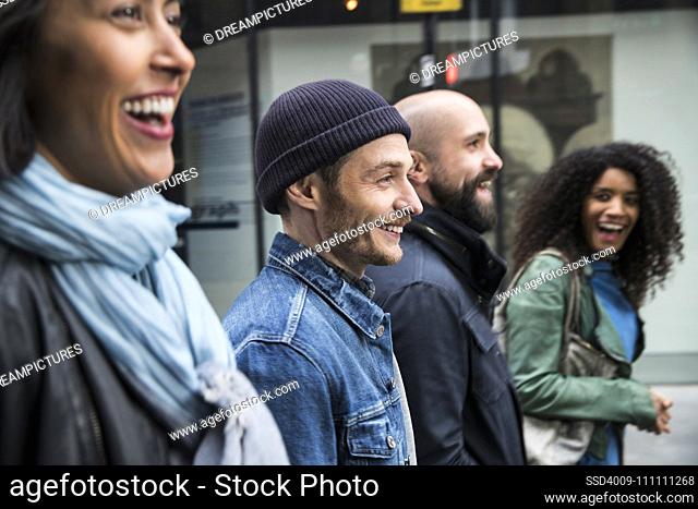 group of friends walking the streets of London
