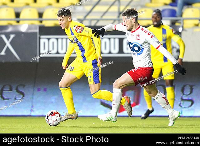 STVV's Facundo Colidio and Kortrijk's Petar Golubovic fight for the ball during a soccer match between Sint-Truiden VV and KV Kortrijk