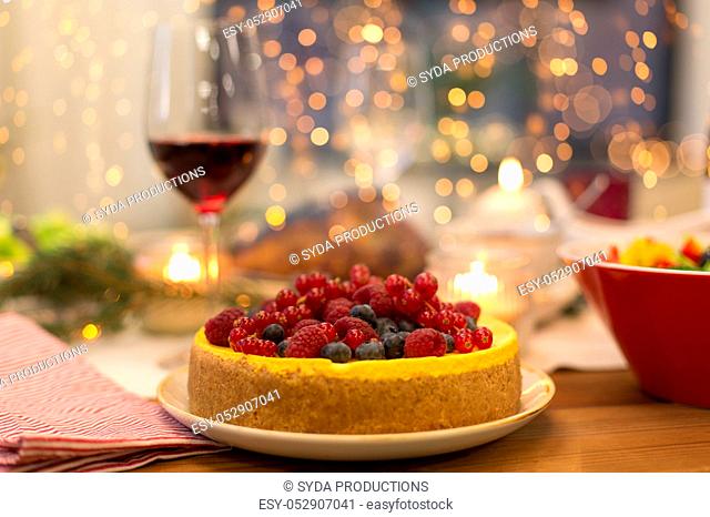 cake and other food on christmas table at home