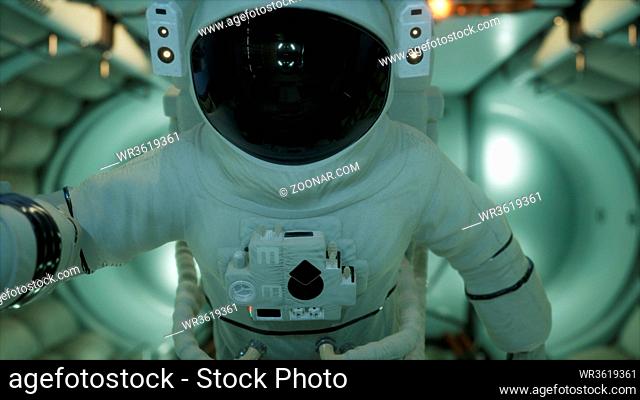 astronaut inside the orbital space station. Elements of this image furnished by NASA