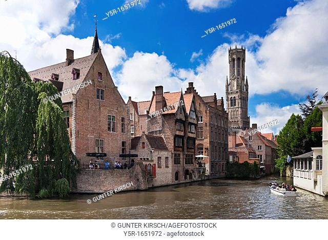View from Rozenhoedkaai via the Reie river to Belfry, built from 1282 to 1482 The tower is 88 meters high The carillon consists of 47 bells, Bruges, Belgium