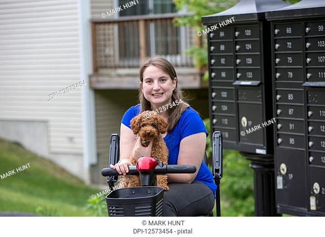 Young Woman with Cerebral Palsy getting the mail with the dog