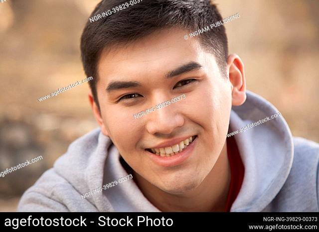 Young man smiling, portrait