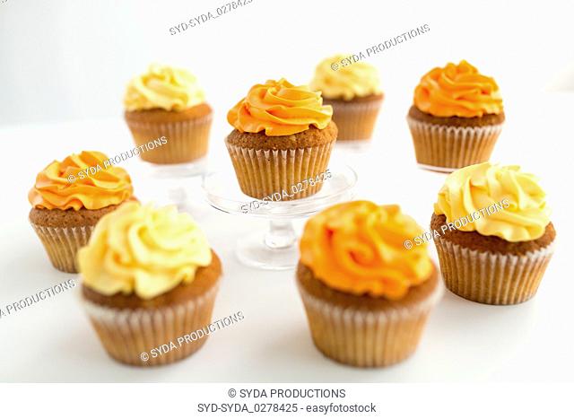 cupcakes with frosting on white background