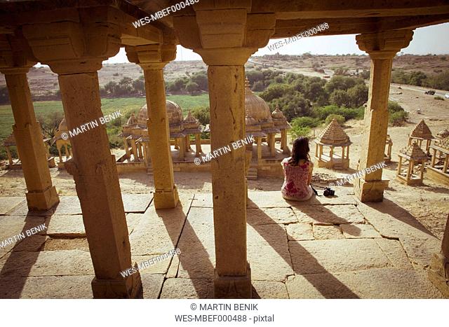 India, Rajasthan, Jaisalmer, Tourist at Bada Bagh Cenotaphs