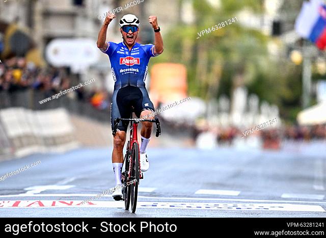 Dutch Mathieu van der Poel of Alpecin-Deceuninck celebrates as he crosses the finish line to win the 'Milano-Sanremo' one day cycling race