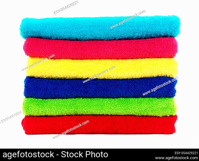 Colored bathroom towels isolated against a white background