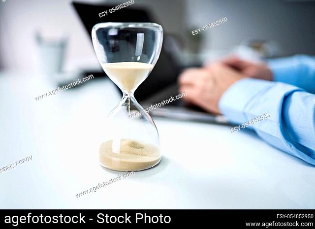 Man Working On Laptop Under Time Pressure