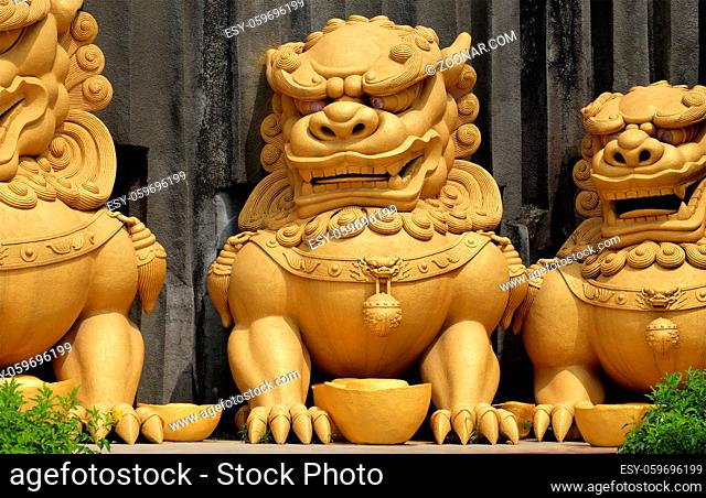 HO CHI MINH CITY, VIET NAM- JUNE 1, 2017: Group of yellow statue of unicorn at Suoi Tien tourist area, place for cultural travel with amazing sculpture art