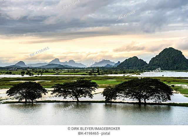 Sunset above tower karst mountains, artificial lake, landscape in the evening light, Hpa-an, Karen or Kayin State, Myanmar