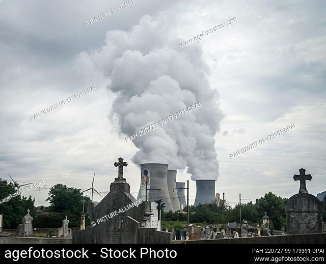 01 August 2015, France, Cruas: The cooling towers of the Cruas nuclear power plant in the Ardeche department in the Auvergne-Rhone-Alpes region of France with a...