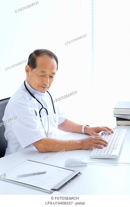 Male Doctor Working in Office