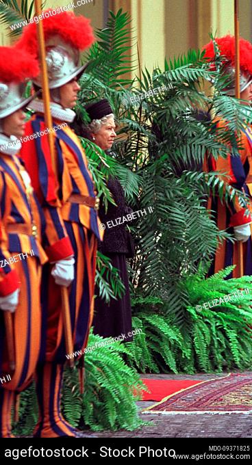 Queen Elizabeth II at the exit next to the Swiss Guards, at a private audience with Pope John II. Vatican (Vatican City), October 17th, 2000
